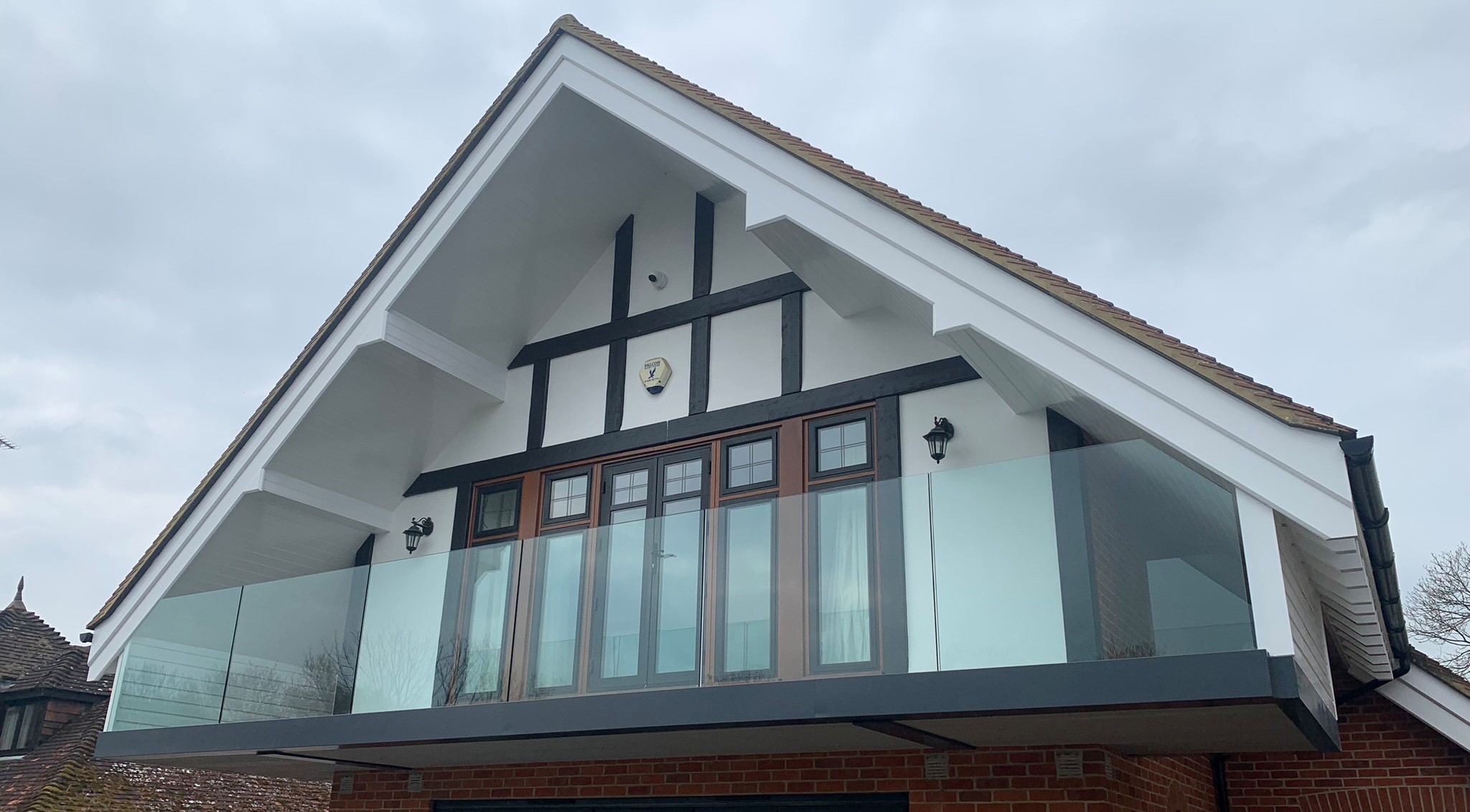large frameless glass balcony on house