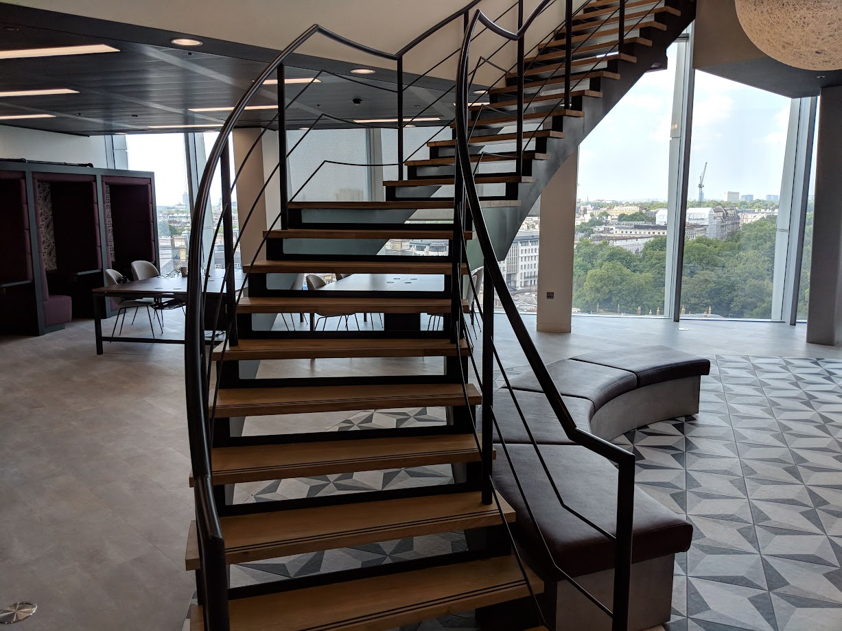 helical black handrail wooden treads