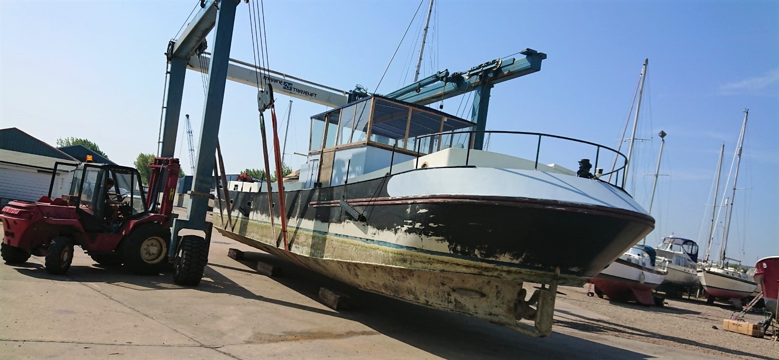 large boat repairs lifted at marina