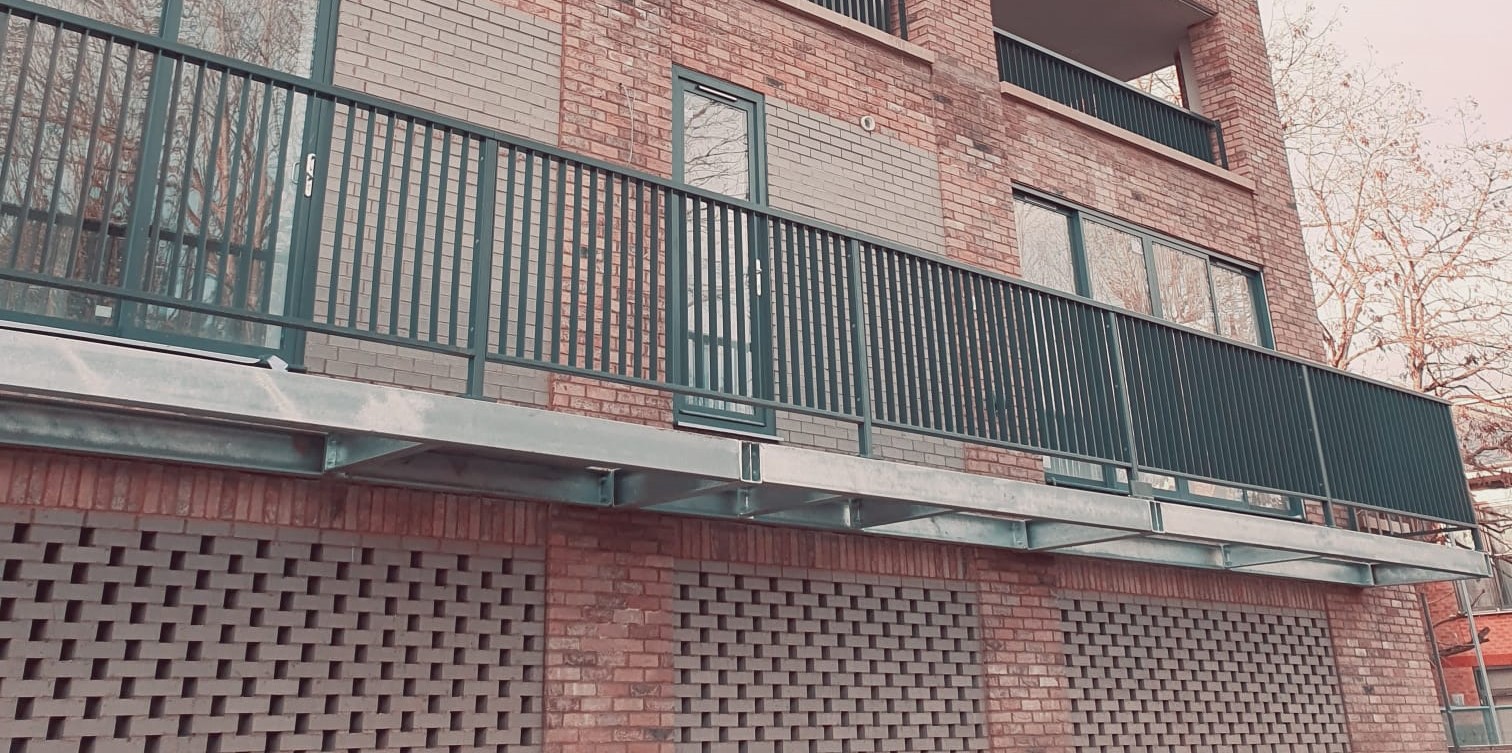 steel balcony on brick apartments